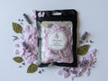 Wax Melts: Sovaré Lavender & Patchouli in pink wax chunks inside a black resealable pouch.