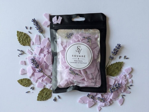 Wax Melts: Sovaré Lavender & Patchouli in pink wax chunks inside a black resealable pouch.