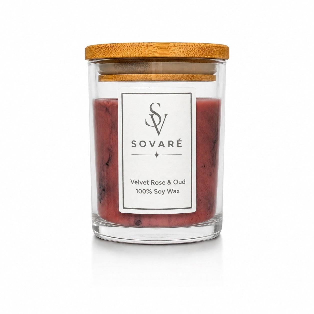 Velvet Rose & Oud Scented Candle by Sovaré in a clear glass jar with a wooden lid, 100% soy wax